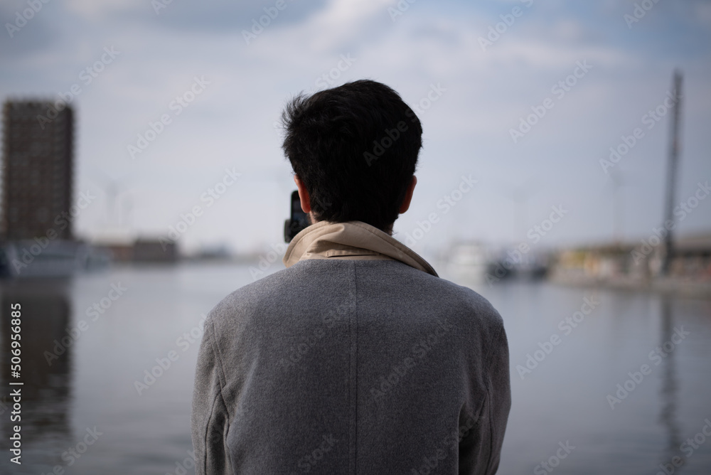 man looking out the sea