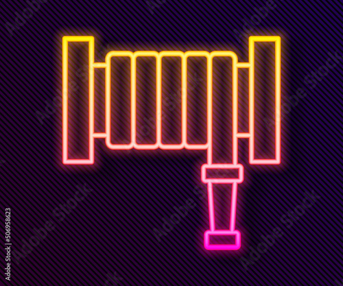 Glowing neon line Fire hose reel icon isolated on black background. Vector