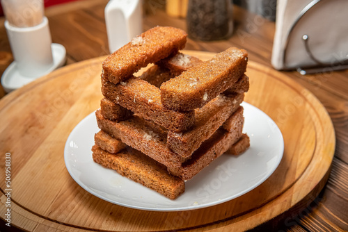 stack of fried crackers on a plate