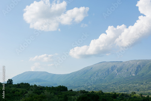 Beautiful panorama view of Suva Planina, a chain of mountains and hills in Serbia, with forests, hills and agricultural fields on a spring sunny day