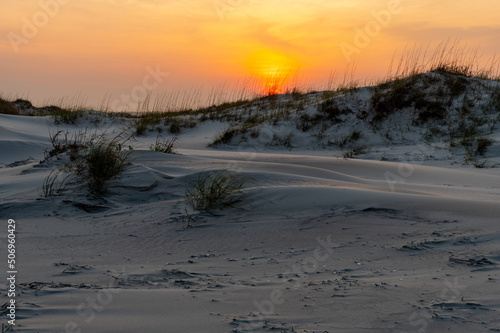 Sun Dropping over the Dunes