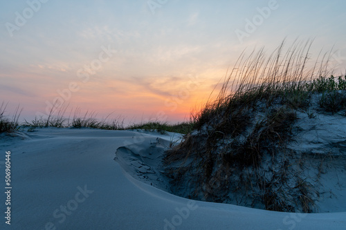 Evening Sky behind Sand Dune with Flowing Grass