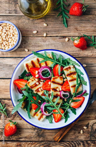 Grilled halumi salad with pine nuts, strawberries and arugula.