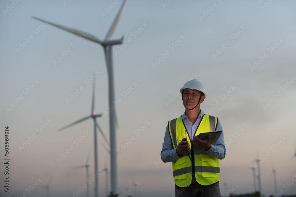 engineer with turbine. person with turbine. person with turbine in the field. engineer with turbine. person with turbine. person with turbine in the field.