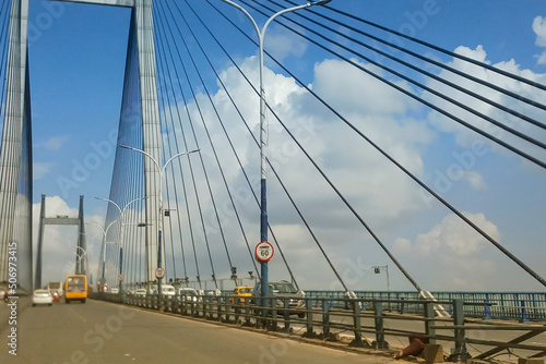 HOWRAH, WEST BENGAL , INDIA - JULY 8TH 2018 : Vidyasagar Setu (Bridge) over river Ganges, 2nd Hooghly Bridge. Connects Howrah and Kolkata, Longest Cable - stayed bridge in India. #506973415