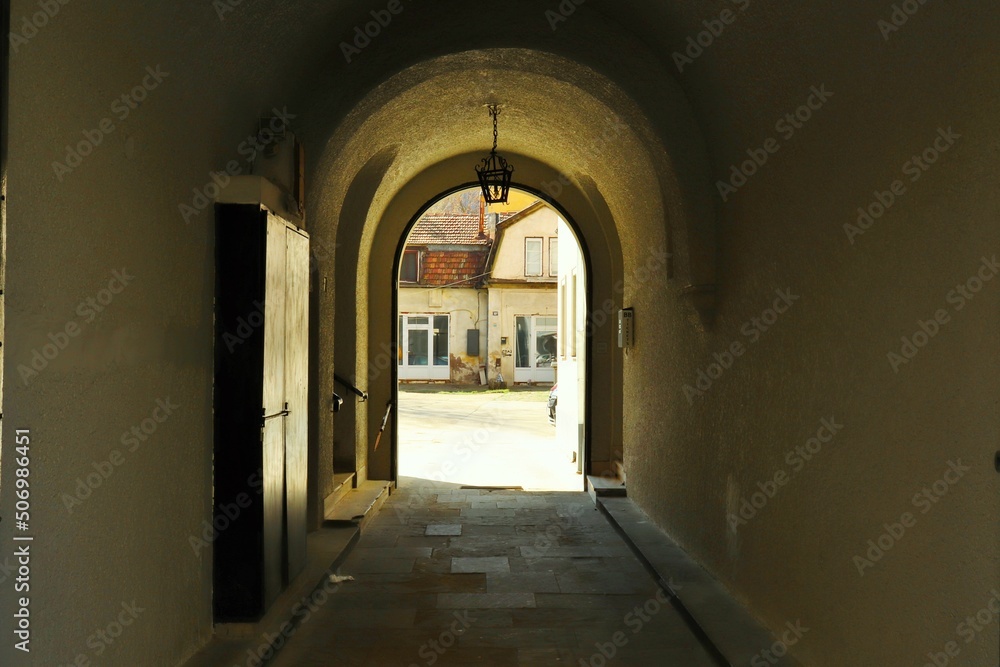 view through the arch to the courtyard of the house
