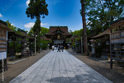 The shrine gate, approach and lantern of Kitano-tenmanguu.  Kyoto Japan  © haseg77
