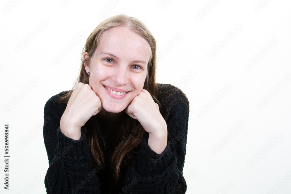 Attractive blonde young woman with beautiful smile hands on chin on white background Attractive blonde young woman with beautiful smile hands on chin on white background