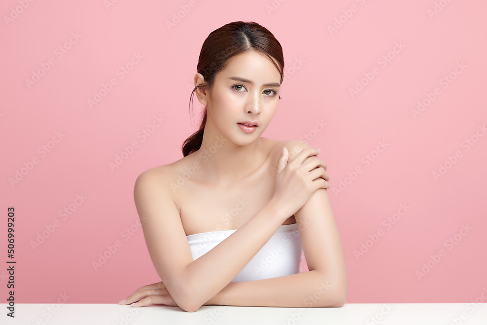 Beautiful young asian woman with clean fresh skin on pink background, Face care, Facial treatment, Cosmetology, beauty and spa, Asian women portrait. Beautiful young asian woman with clean fresh skin on pink background, Face care, Facial treatment, Cosmetology, beauty and spa, Asian women portrait.