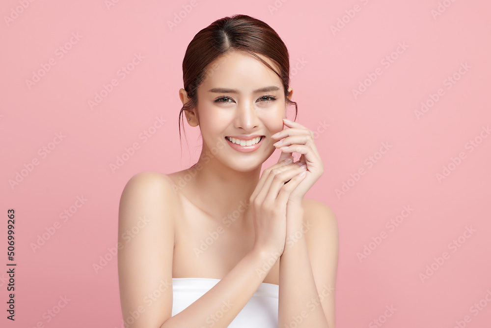 Beautiful young asian woman with clean fresh skin on pink background, Face care, Facial treatment, Cosmetology, beauty and spa, Asian women portrait.