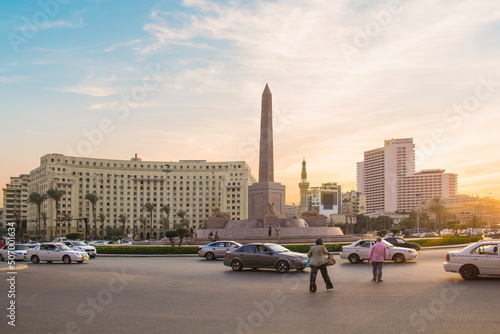 CAIRO, EGYPT - DECEMBER 29, 2021: The Obelisk of Ramses II is surrounded by four ancient sandstone sphinxes in Cairo, Egypt