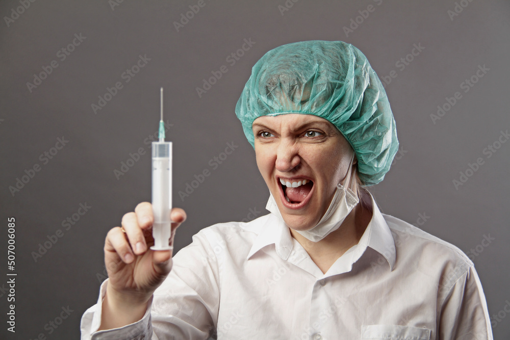 Closeup of a female doctor with syringe Closeup of a female doctor with syringe