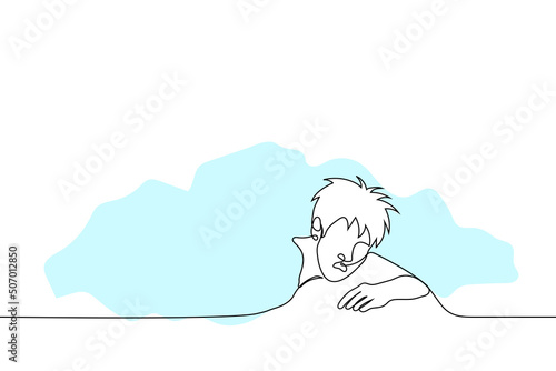 man leaning out from under the blanket - one line drawing vector. a shaggy man lying on his stomach with his mouth open just woke up or was awakened by someone. concept morning awakening