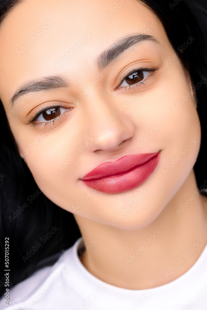 procedure after permanent make-up of the lips close-up lips of the model tattooed with red pigment procedure after permanent make-up of the lips close-up lips of the model tattooed with red pigment