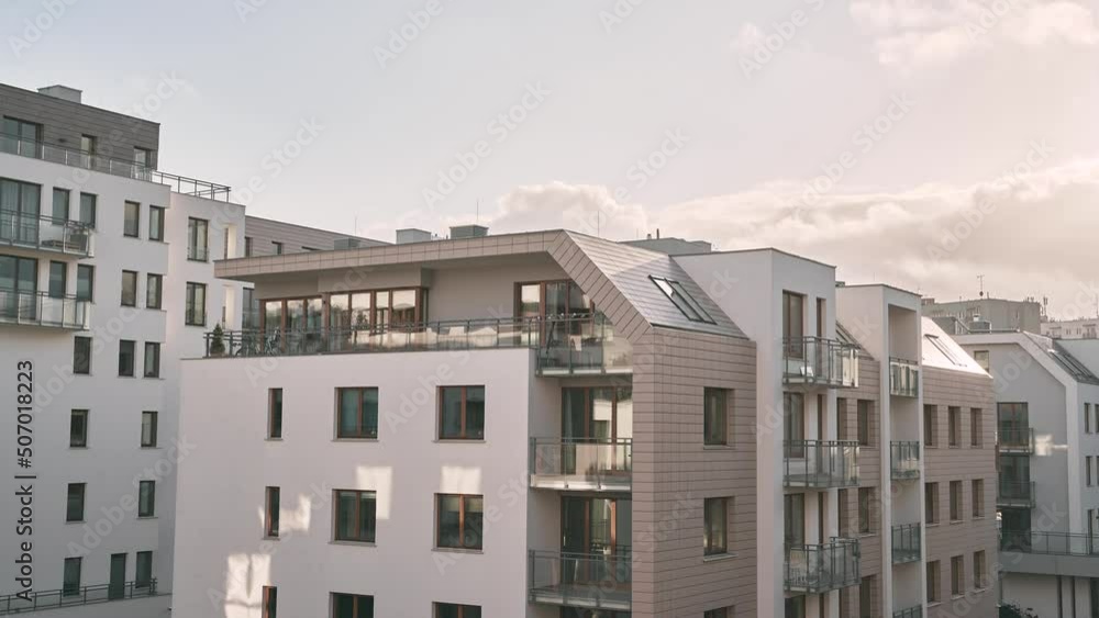Modern apartment building in the city timelapse. Contemporary condominium with sky moving in the background Modern apartment building in the city timelapse. Contemporary condominium with sky moving in the background