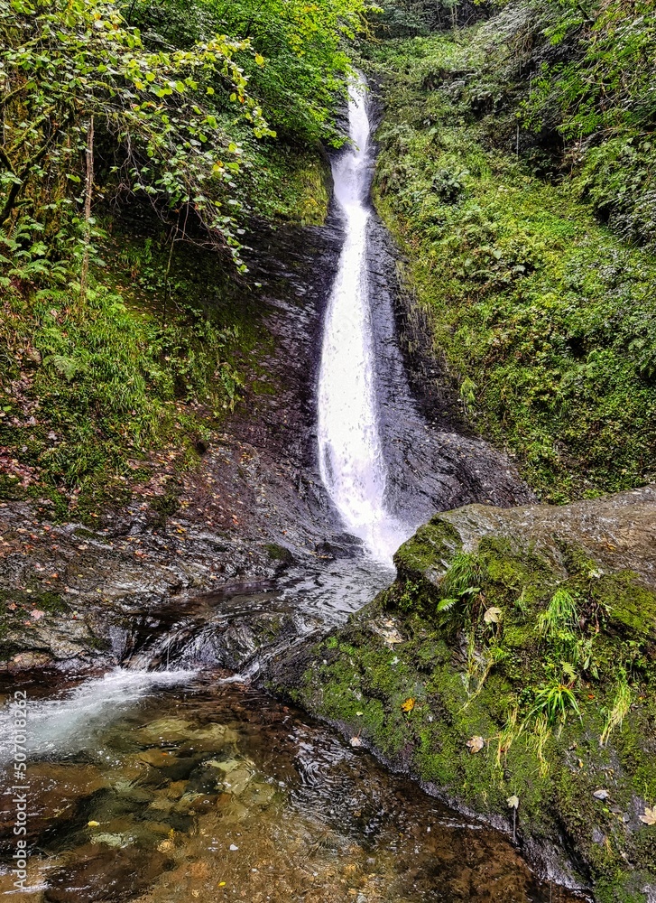 Fototapeta premium Whitelady waterfall in rain - Lydford Gorge, Dartmoor National Park, Devon, United Kingdom