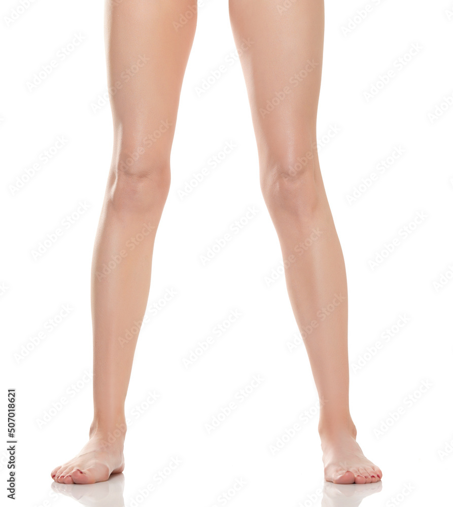 Front view of beautifully cared women's legs and feet on white background Front view of beautifully cared women's legs and feet on white background