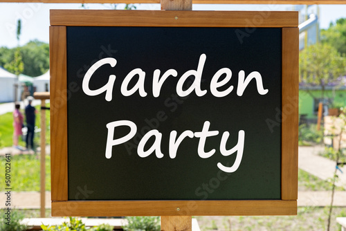 Black chalkboard with the inscription Garden Party in the garden