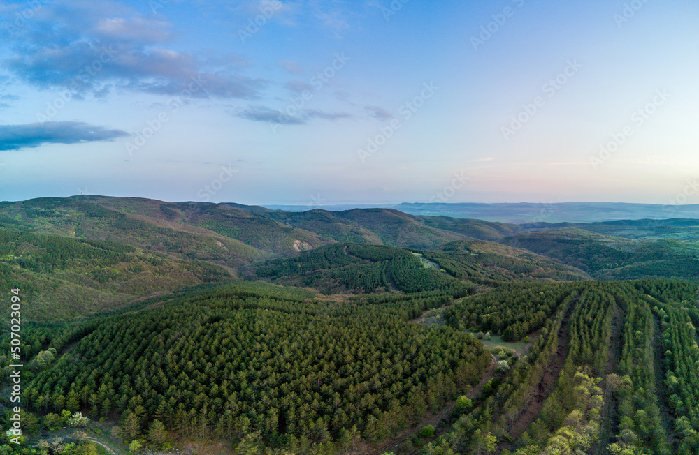 Panorama of a view from a height of the meadows and slopes of the Balkan Mountains under daylight in Bulgaria Panorama of a view from a height of the meadows and slopes of the Balkan Mountains under daylight in Bulgaria