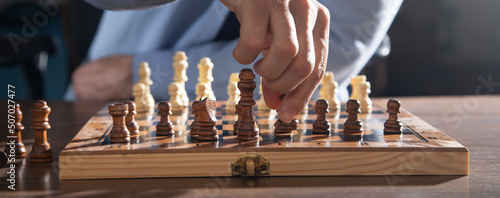 Fotografia Caucasian man playing chess board game.