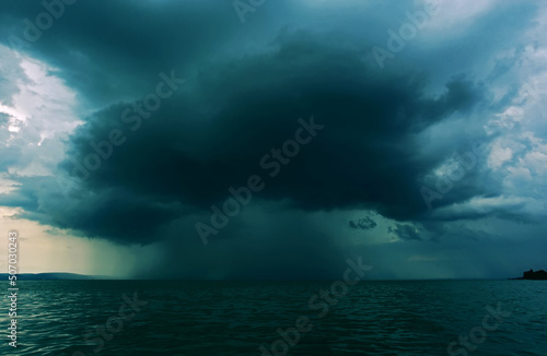Supercell thunderstrom foorming above water surface