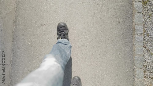 POV of person legs walking on road almost step in brown dog crap 4K
