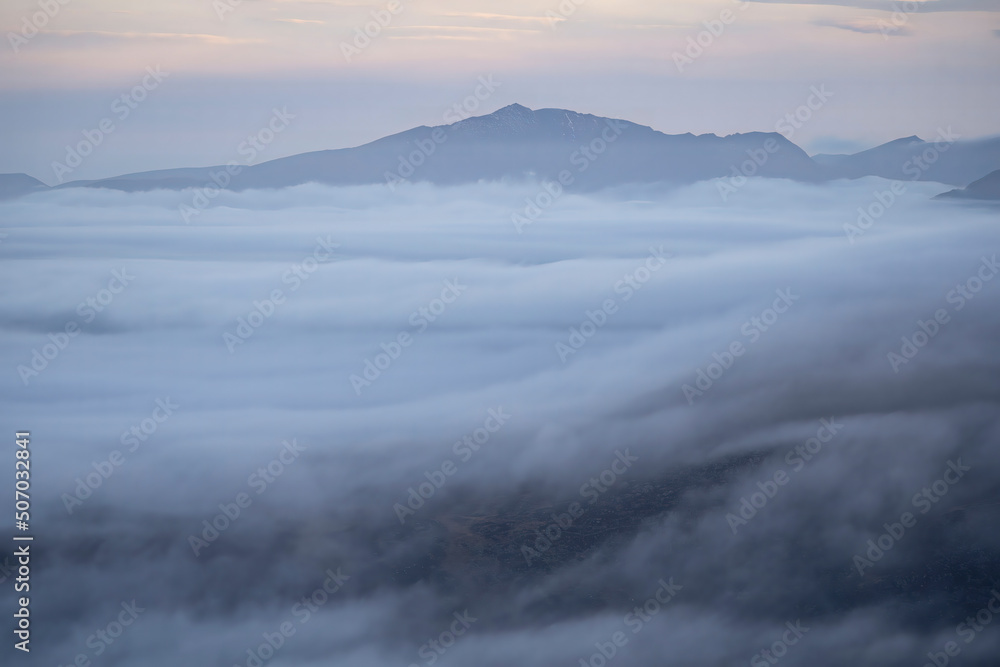 Mount Snowdon above the cloud at dawn with inversion weather Mount Snowdon above the cloud at dawn with inversion weather