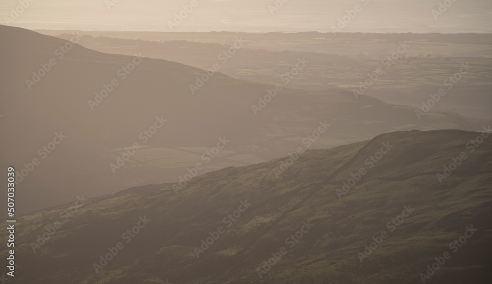 Murky mountain scene with coastal background in Snowdonia national park