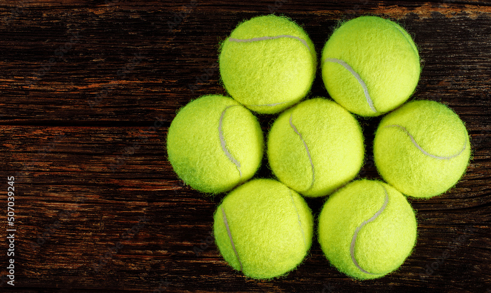 Tennis balls on wooden background, sport concept, rustic style, stock photo, space for text