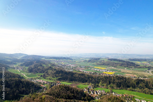 Aerial view over rural landscape seen from local mountain Uetliberg on a blue cloudy spring day. Photo taken April 21st, 2022, Zurich, Switzerland.