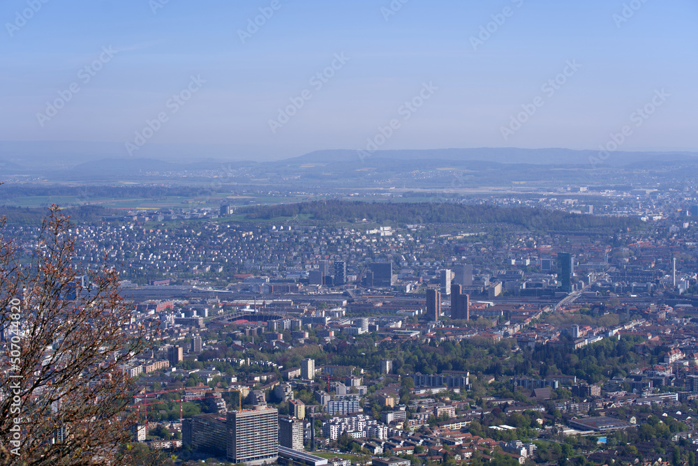 Aerial view over City of Zürich on a beautiful spring day with blue cloudy sky background. Photo taken April 21st, 2022, Zurich, Switzerland.
