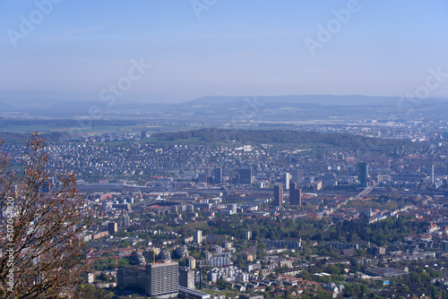 Aerial view over City of Zürich on a beautiful spring day with blue cloudy sky background. Photo taken April 21st, 2022, Zurich, Switzerland. © Michael Derrer Fuchs