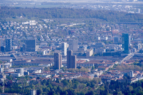 Aerial view over City of Zürich seen from local mountain Uetliberg on a sunny spring day. Photo taken April 21st, 2022, Zurich, Switzerland.