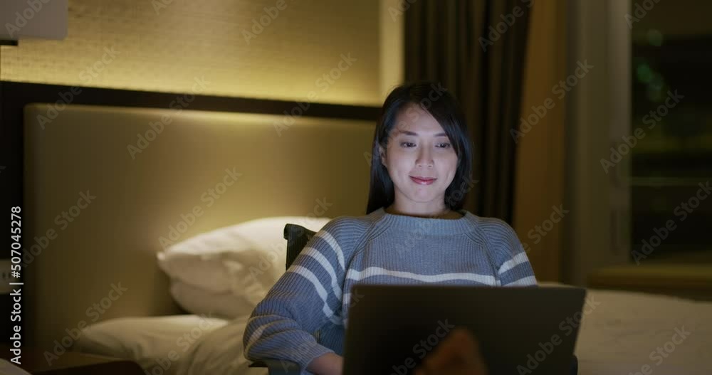 Woman work on laptop computer at night Woman work on laptop computer at night