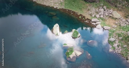 Flying over a beautiful lake in the Italian alps. The lake is called Lago Zancone photo