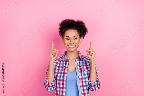 Photo of impressed curly hairdo lady index up wear blue shirt isolated on pink color background