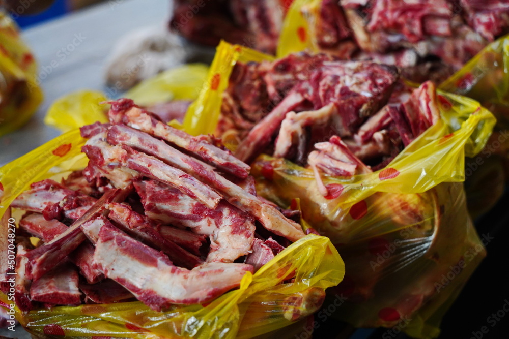 Almaty, Kazakhstan - 03.25.2022 : Different parts of meat are prepared for sale on the open market. Almaty, Kazakhstan - 03.25.2022 : Different parts of meat are prepared for sale on the open market.