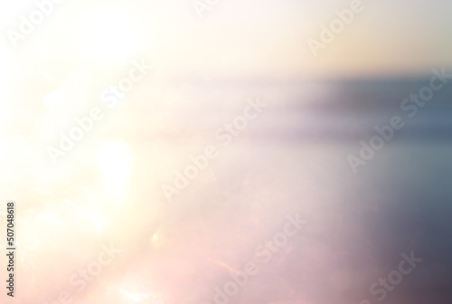 background of blurred beach and sea waves with bokeh lights, vintage filter.
