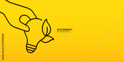 Hand holding light bulb on yellow background, Pollution and environment protection concept, Green energy electricity usage.
