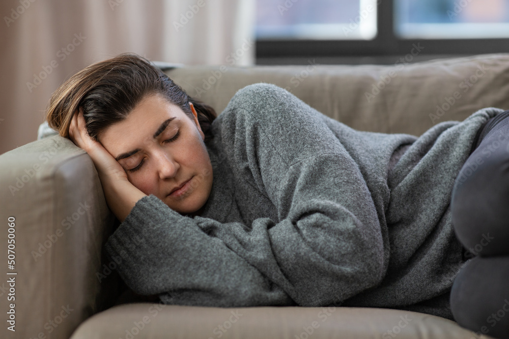 mental health, psychological problem and depression concept - stressed woman lying on sofa at home mental health, psychological problem and depression concept - stressed woman lying on sofa at home