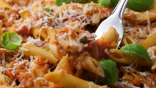 Eating JackFruit pasta with garlic, olives, capers, tomato and cheese. Healthy vegan, diet food