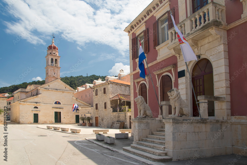 Town house and Catholic church in Pucisca city on island Brac, Croatia