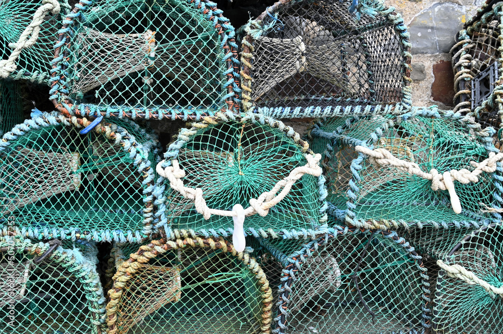 Fish trap for lobster and crab. Abstract pattern, Devon, Great Britain. Blue Lobster pots. Fish trap for lobster and crab. Abstract pattern, Devon, Great Britain. Blue Lobster pots.