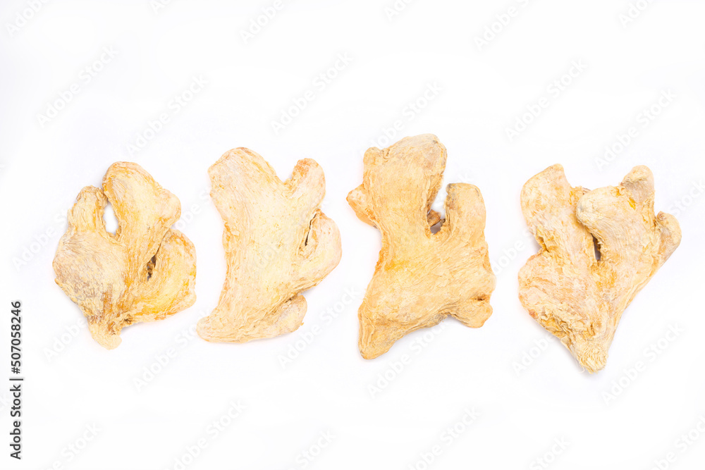Dried ginger root on white background isolated. Indian spices close up. Dried ginger root on white background isolated. Indian spices close up.