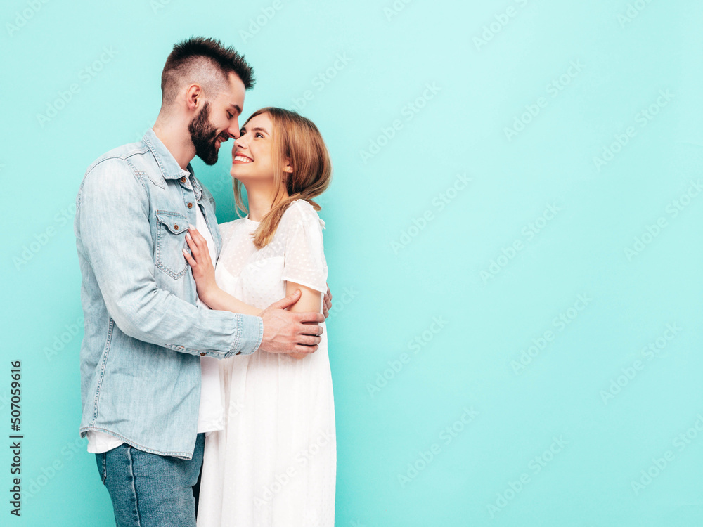 Sexy smiling beautiful woman and her handsome boyfriend. Happy cheerful family having tender moments near blue wall in studio.Pure cheerful models hugging.Embracing each other. Cheerful and happy Sexy smiling beautiful woman and her handsome boyfriend. Happy cheerful family having tender moments near blue wall in studio.Pure cheerful models hugging.Embracing each other. Cheerful and happy