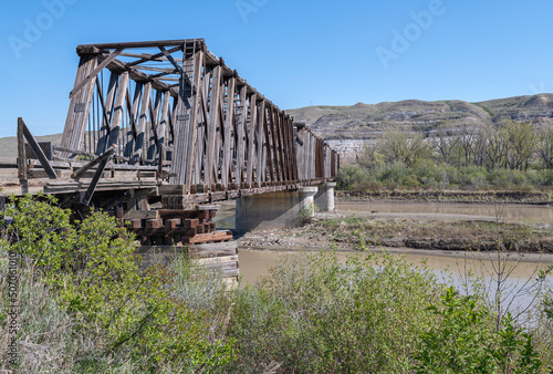 Historic Howe truss train bridge crossing the Red Deer River near Drumheller photo