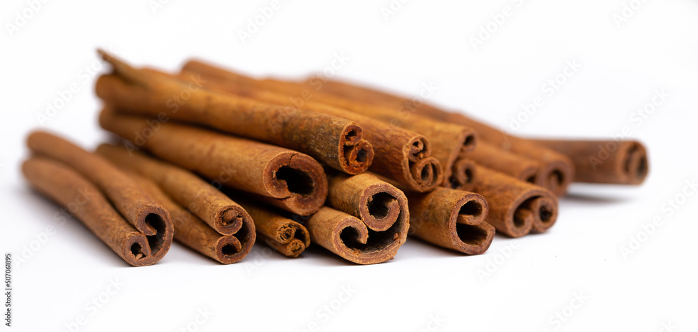 Cinnamon sticks on white background isolated. Indian spices close up. Medicinal herbs and spices. Cinnamon sticks on white background isolated. Indian spices close up. Medicinal herbs and spices.