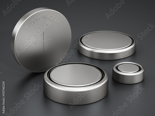 Group of button cells standing on black background. 3D illustration photo