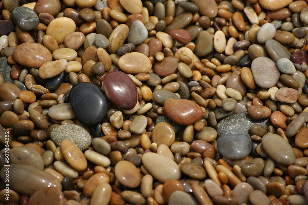 It is a stone that has been cut into a round pebble shape as the rock has been broken and eroded by waves and wind over a long period of time. To the touch, it is as smooth as silk.