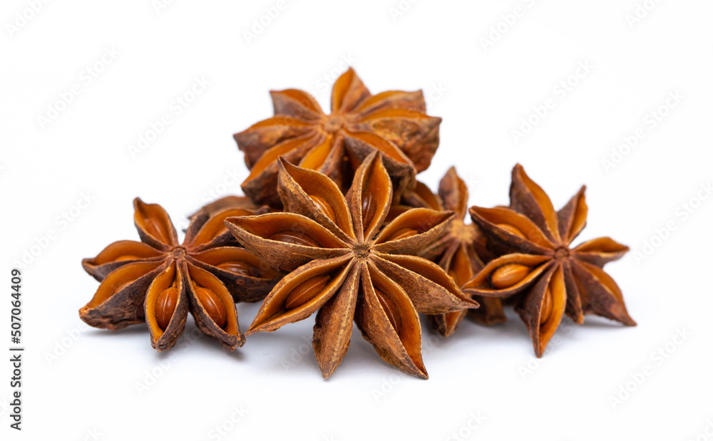 Star anise on a white background isolated. Indian spices close up. Medicinal herbs and spices. Star anise on a white background isolated. Indian spices close up. Medicinal herbs and spices.